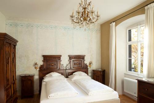 Postel nebo postele na pokoji v ubytování Villa Bergmann Suites Meran