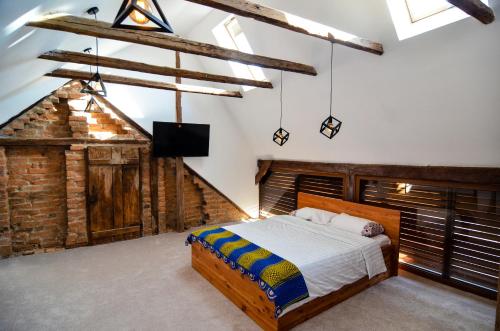 Кровать или кровати в номере Agropensiunea Maria