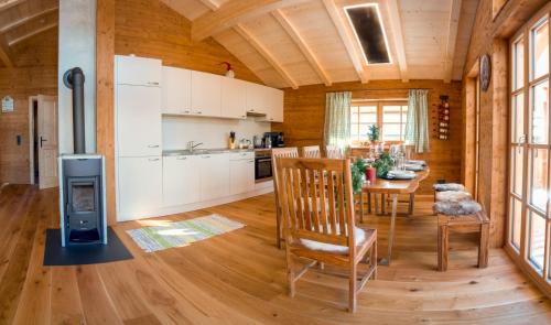 a kitchen with a table and a stove in a room at Jagdhütte in Lachtal