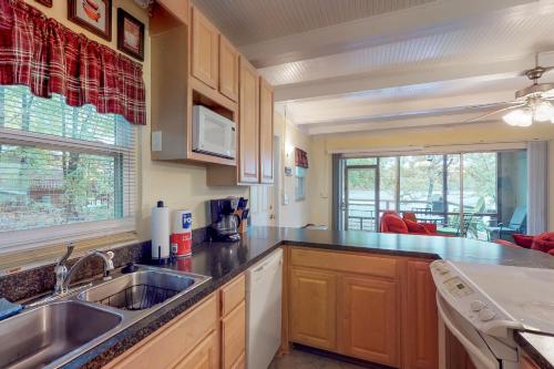 a kitchen with a sink and a counter top at Captain's Cove in Lake Murray Shores