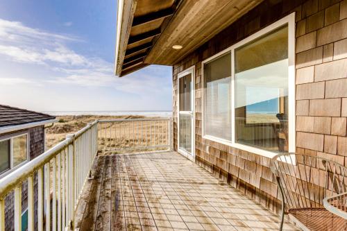 a balcony with a view of the ocean at Frannie's Beachfront in Seaside