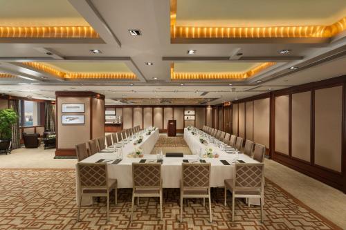 a conference room with a long table and chairs at Mandarin Oriental, Hong Kong in Hong Kong