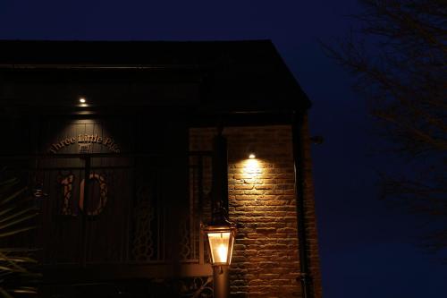a building with lights on the side of it at night at The Impeccable Pig in Sedgefield