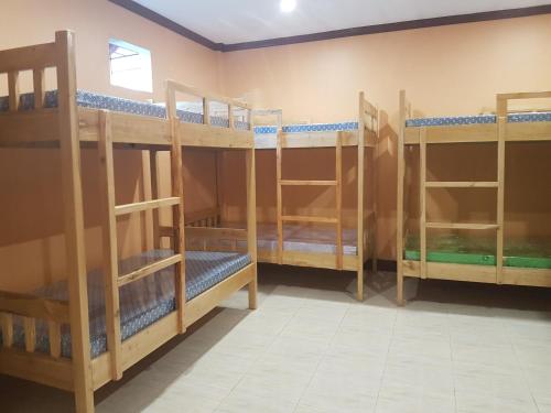 a group of bunk beds in a room at Stella'z guesthouse in Siquijor