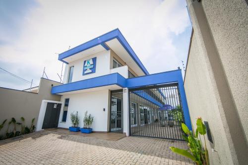 a house with a blue and white facade at K1 RESIDENCE Taquaral in Campinas