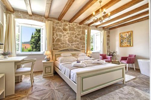 Ein Bett oder Betten in einem Zimmer der Unterkunft Villa Princess Captislava