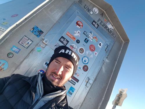 a man standing in front of a door with stickers on it at Amata Valgre Affittacamere, comfort e pulizia eccezionali!! in Olginate