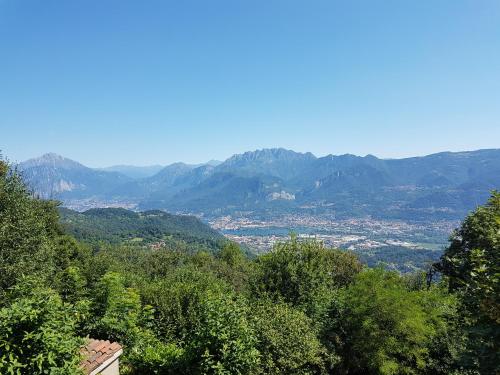 a view of a valley with mountains in the distance at Amata Valgre Affittacamere, comfort e pulizia eccezionali!! in Olginate