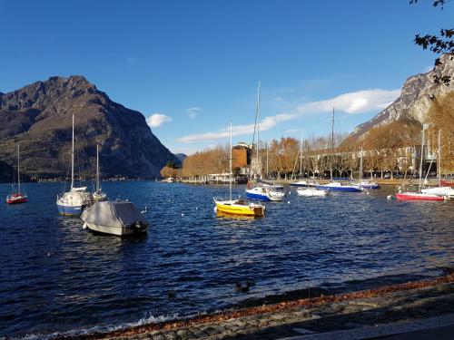 a group of boats in a body of water at Le Casette Di Osvaldo in Lecco