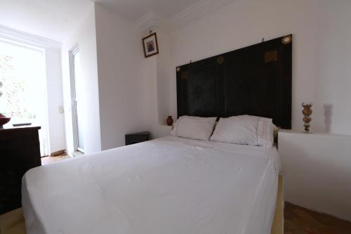 Postel nebo postele na pokoji v ubytování Riad Elli Marrakech