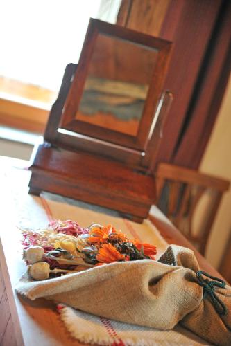 a wooden table with a box on top of it at Affittacamere De Charme Jour Et Nuit in Torgnon