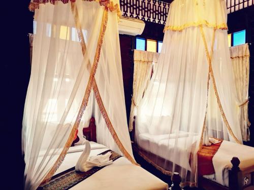 Baan Sithepaban Guesthouseにあるベッド