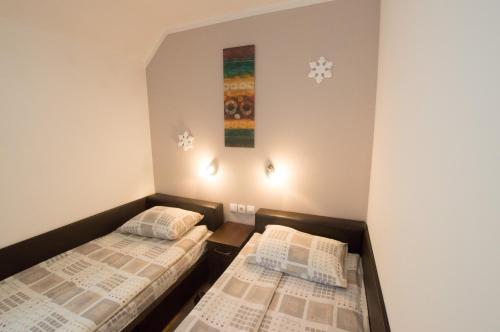 מיטה או מיטות בחדר ב-Rooms Sejo