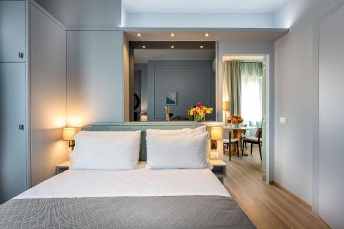 a bedroom with a large bed with white pillows at Uno Sguardo su Firenze in Florence