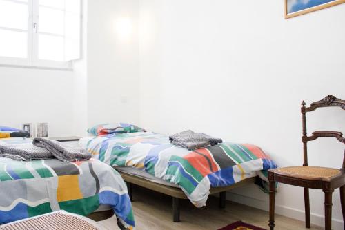 Säng eller sängar i ett rum på Flamingo House - historic center free garage