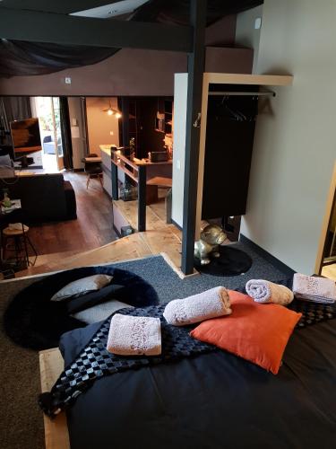 a bedroom with a bed with pillows on it at Au detour de Gournay in Gournay-en-Bray