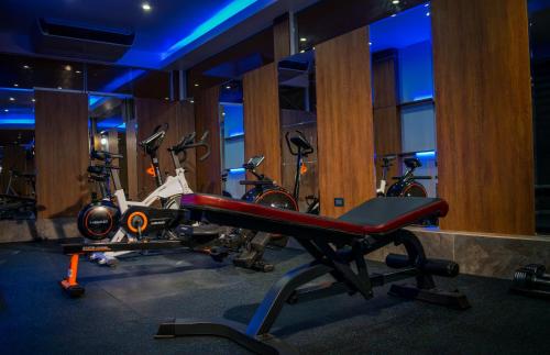 a gym with several exercise bikes in a room at Lyz Business Hotel in Lima