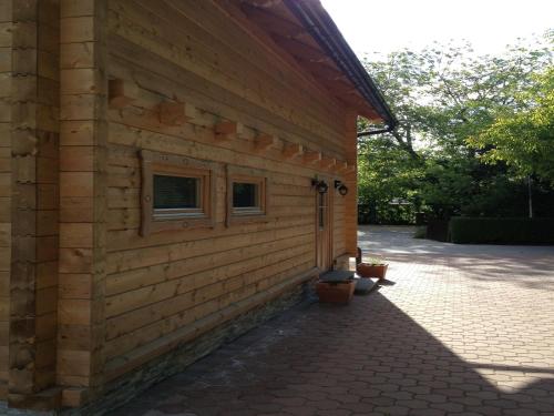 a building with two windows on the side of it at Apartments Vila Cvetka Bled in Bled