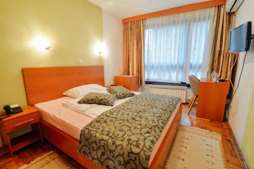 Postel nebo postele na pokoji v ubytování Hotel Mod