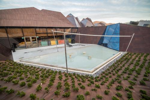 an overhead view of a building with a swimming pool at Apartment Amy in Podčetrtek