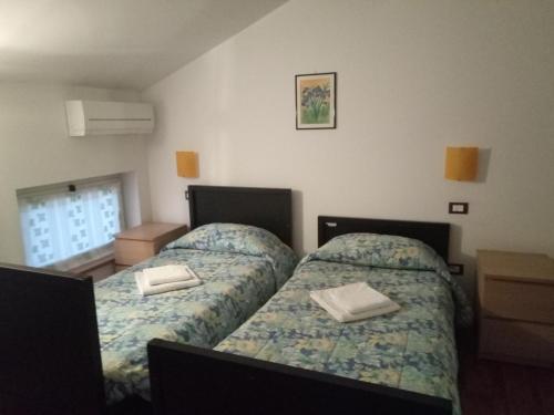 Una cama o camas en una habitación de B&B Q3 Home