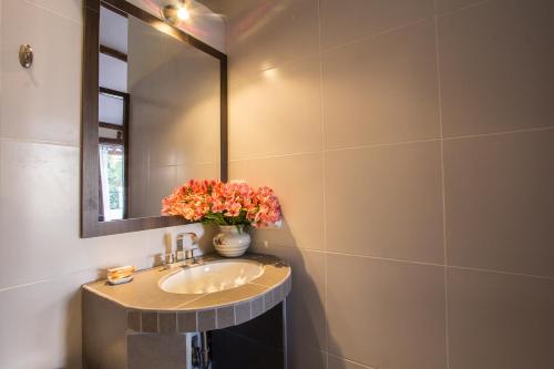 a bathroom with a sink and a mirror at Luna House Cusco in Cusco