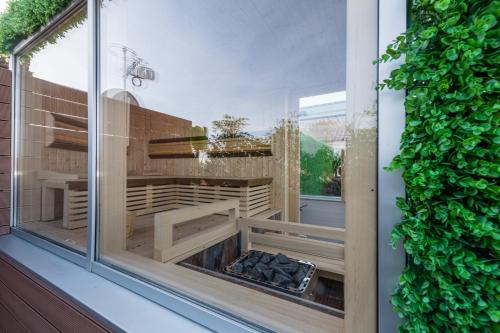 a glass window with a fire pit inside of it at Boutique hotel Tvrđa in Osijek