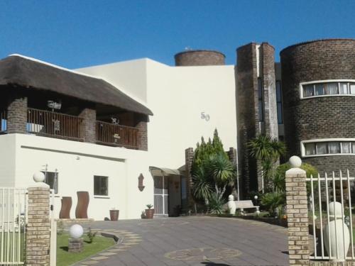 a white building with two smoke stacks on top of it at Karoo View Guesthouse Cradock in Cradock
