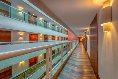 a corridor of a hospital with a long aisle at Wyndham Rio Barra in Rio de Janeiro