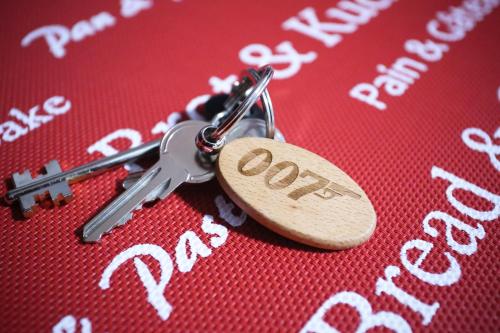 a pair of keys sitting on top of a table at Villa Borak Sarajevo in Sarajevo