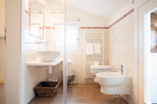a bathroom with a toilet and a sink at White House in Orvieto