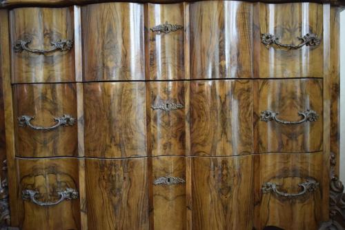 a woodenievalievalievalieval wooden cabinet with black handles at Villa Storica Calderino in Monte San Pietro