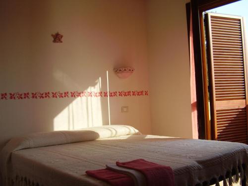 Ένα ή περισσότερα κρεβάτια σε δωμάτιο στο Agriturismo Cuile de Molino