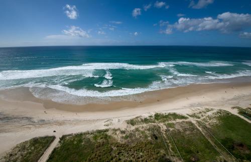 an aerial view of a beach with the ocean at Berkeley on the Beach in Gold Coast