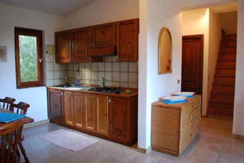 Kuchyň nebo kuchyňský kout v ubytování Residence Oasi e Oasi Blu
