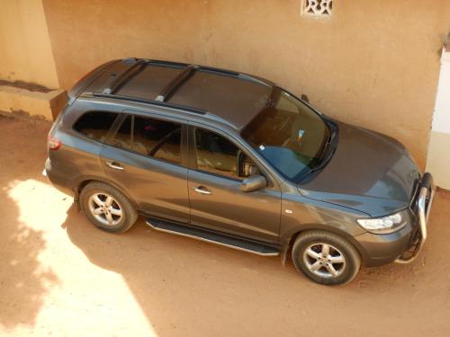 a small car parked next to a building at Residence Saint James in Somone