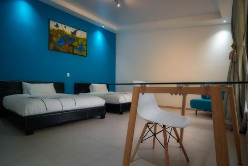 Postel nebo postele na pokoji v ubytování Hotel Quelitales