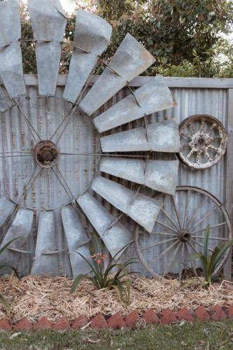 a metal spiral staircase on the side of a fence at The Oaks Lilydale Accommodation in Lilydale