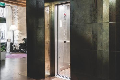 a hallway with a glass door in a building at Vanilla Hotel in Lublin