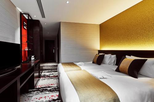 Tempat tidur dalam kamar di The Gate Hotel Tokyo by Hulic