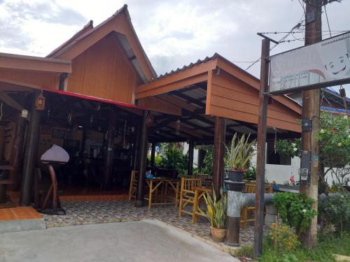 a building with a sign in front of it at Lanta Blue House in Ko Lanta