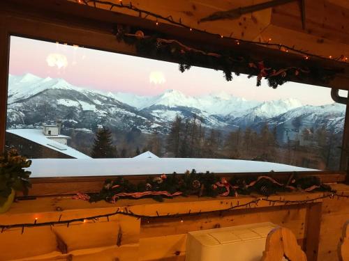 a window with a view of a mountain at Hotel Chacaril in Pila