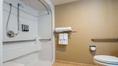 a bathroom with a shower and a toilet at Best Western Plus Pioneer Park Inn in Fairbanks