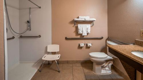 a bathroom with a toilet and a sink and a shower at Best Western Plus Bradenton Hotel & Suites in Bradenton