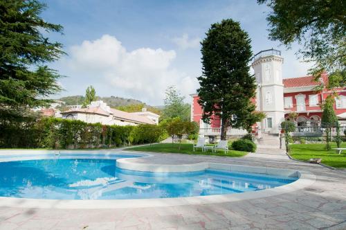 a swimming pool in front of a building at Residence Villa Bottacin in Trieste