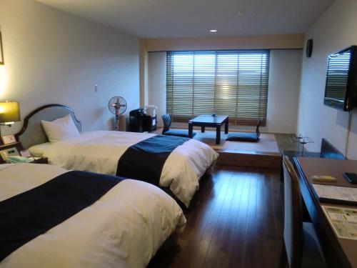 Katil atau katil-katil dalam bilik di Yakushima Green Hotel