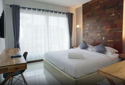 Postel nebo postele na pokoji v ubytování Nan Panwa Hotel