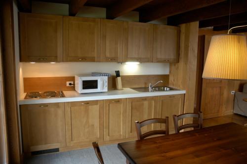 Kuchyň nebo kuchyňský kout v ubytování Pietre Gemelle Resort