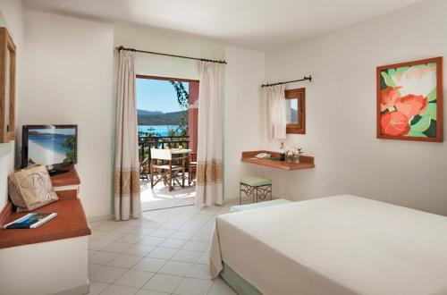 Postel nebo postele na pokoji v ubytování Resort Cala Di Falco
