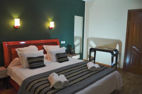 מיטה או מיטות בחדר ב-Anouk Hotel